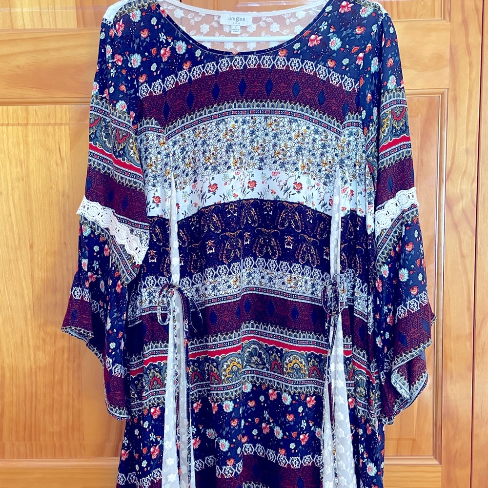 Boho tunic has lace insert across the back shoulders and in the gussets.